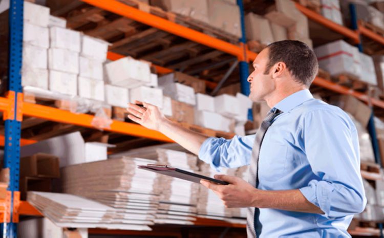 A person in a blue shirt is managing stock inventory